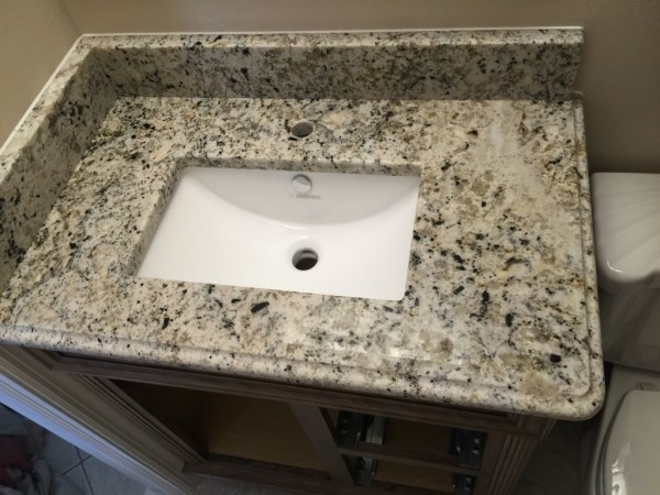 White Fantasy With Ogee Edge and rectangular undermount sink